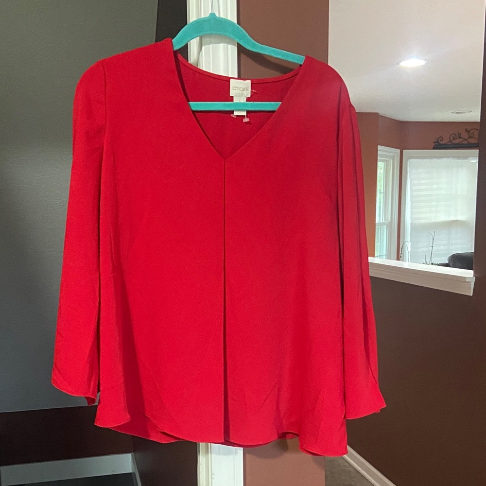 CHICOS - NWOT Vibrant Red V-Neck Blouse
Sleeves have a flow with a  slit .